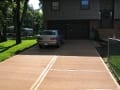 Beige colored concrete driveway with broomed finish - different angle