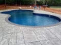 Pool surrounding with paver coping